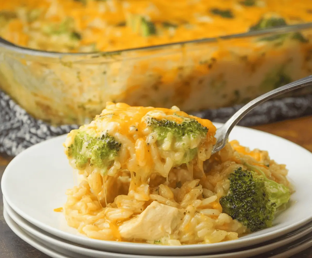 Golden baked creamy chicken broccoli rice cheese casserole with bubbly cheese crust