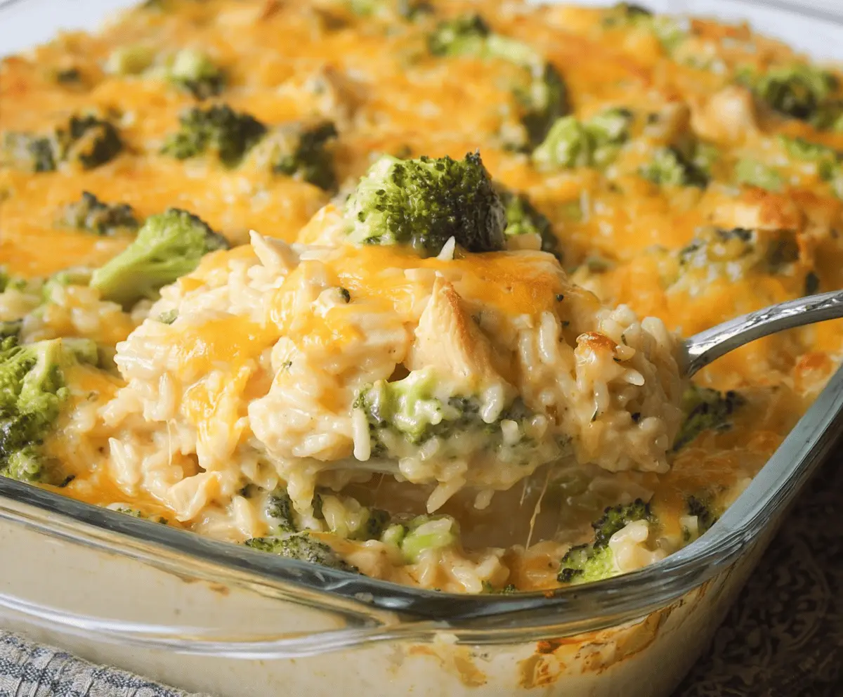 Creamy chicken broccoli rice cheese casserole with golden melted cheese on top