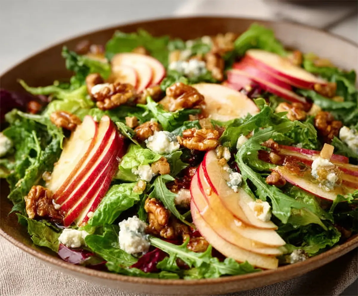 Fresh Honeycrisp Salad with crisp apple slices, mixed greens, and a drizzle of honey for a healthy meal.