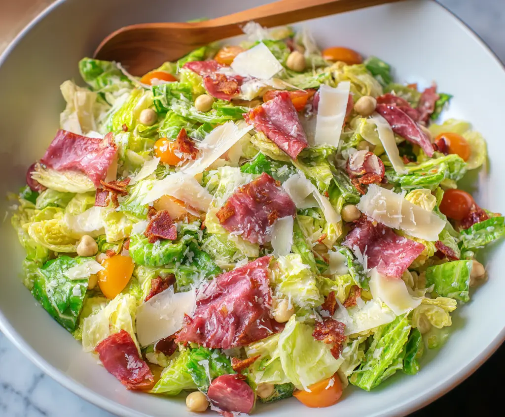 Bright and colorful La Scala Chopped Salad with fresh vegetables and herbs in a bowl