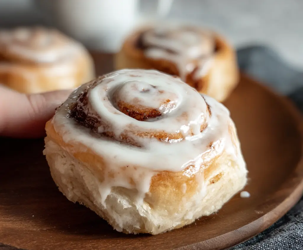 Delicious sourdough discard cinnamon rolls with swirled cinnamon and icing topping