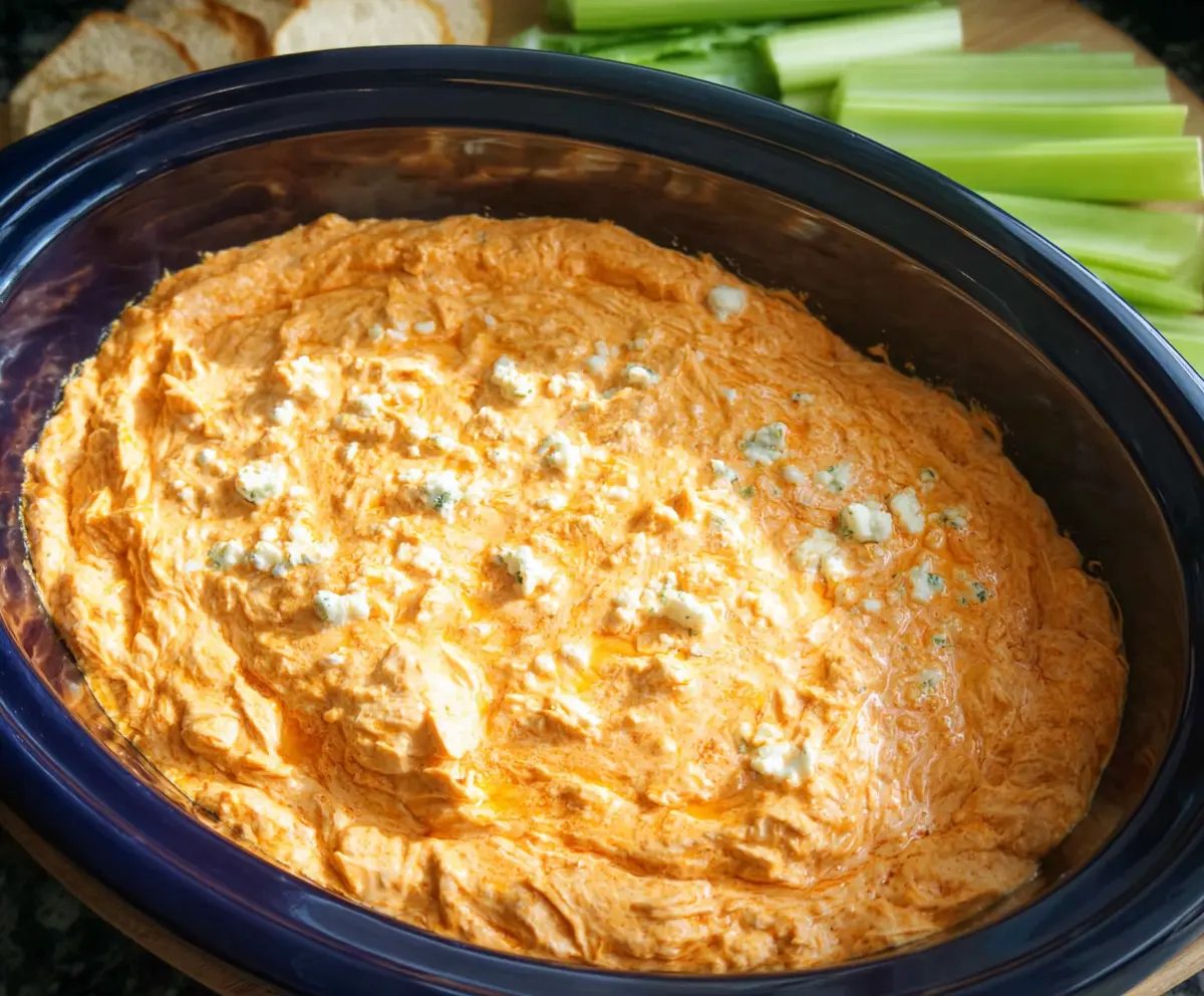 Creamy Crock Pot Buffalo Chicken Dip served with celery sticks and tortilla chips