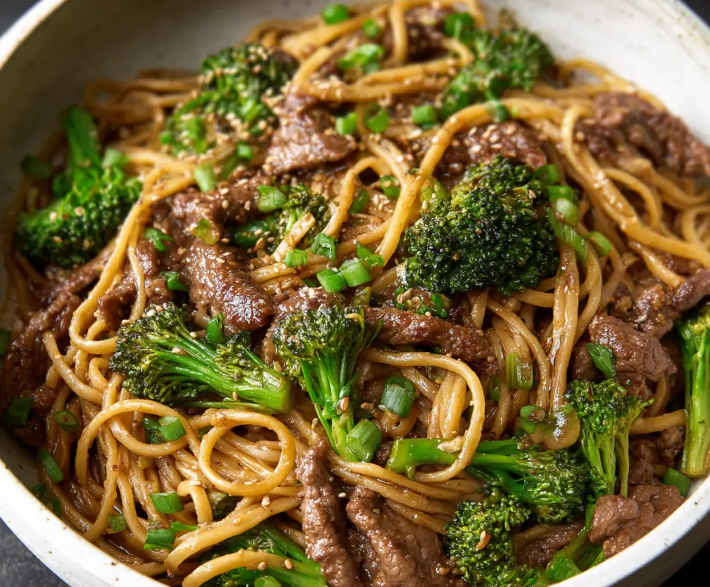 Delicious Garlic Ginger Beef and Broccoli Noodles served on a plate, highlighting a savory Asian-inspired meal with tender beef, fresh broccoli, and noodles.